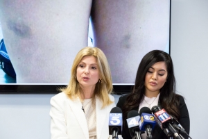 Andrea Buera (R), who is accusing Trey Songz of assaulting her, speaks during a press conference with her attorney Lisa Bloom